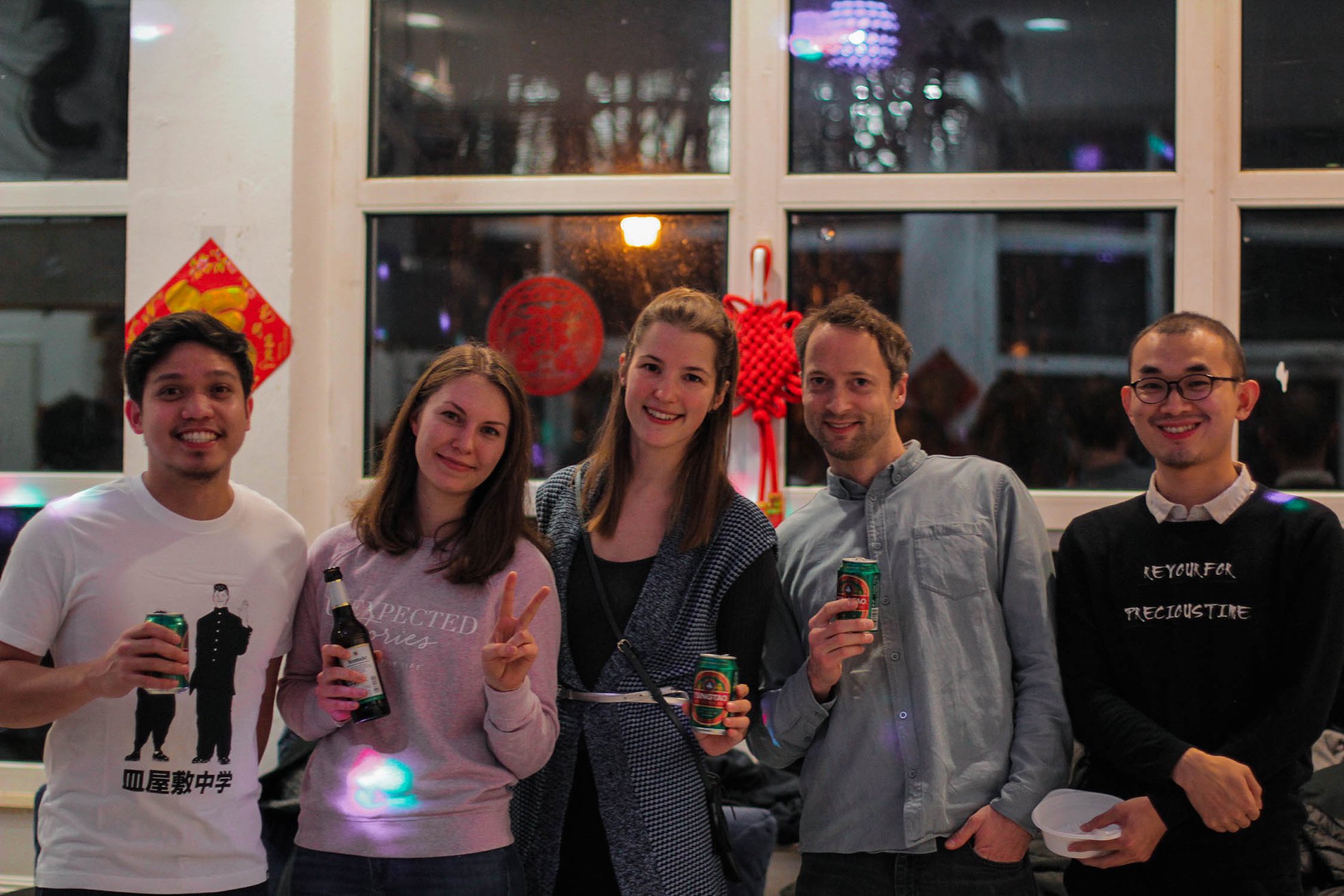 Gabriel Villamil (left) at a celebration of the Chinese Spring Festival with some students.