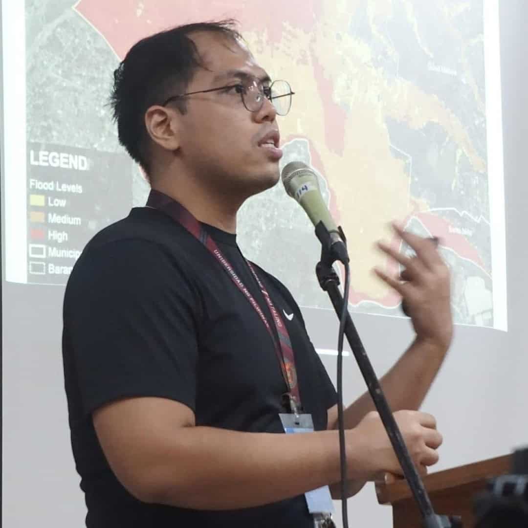 Timothy James Cipriano speaking on a microphone