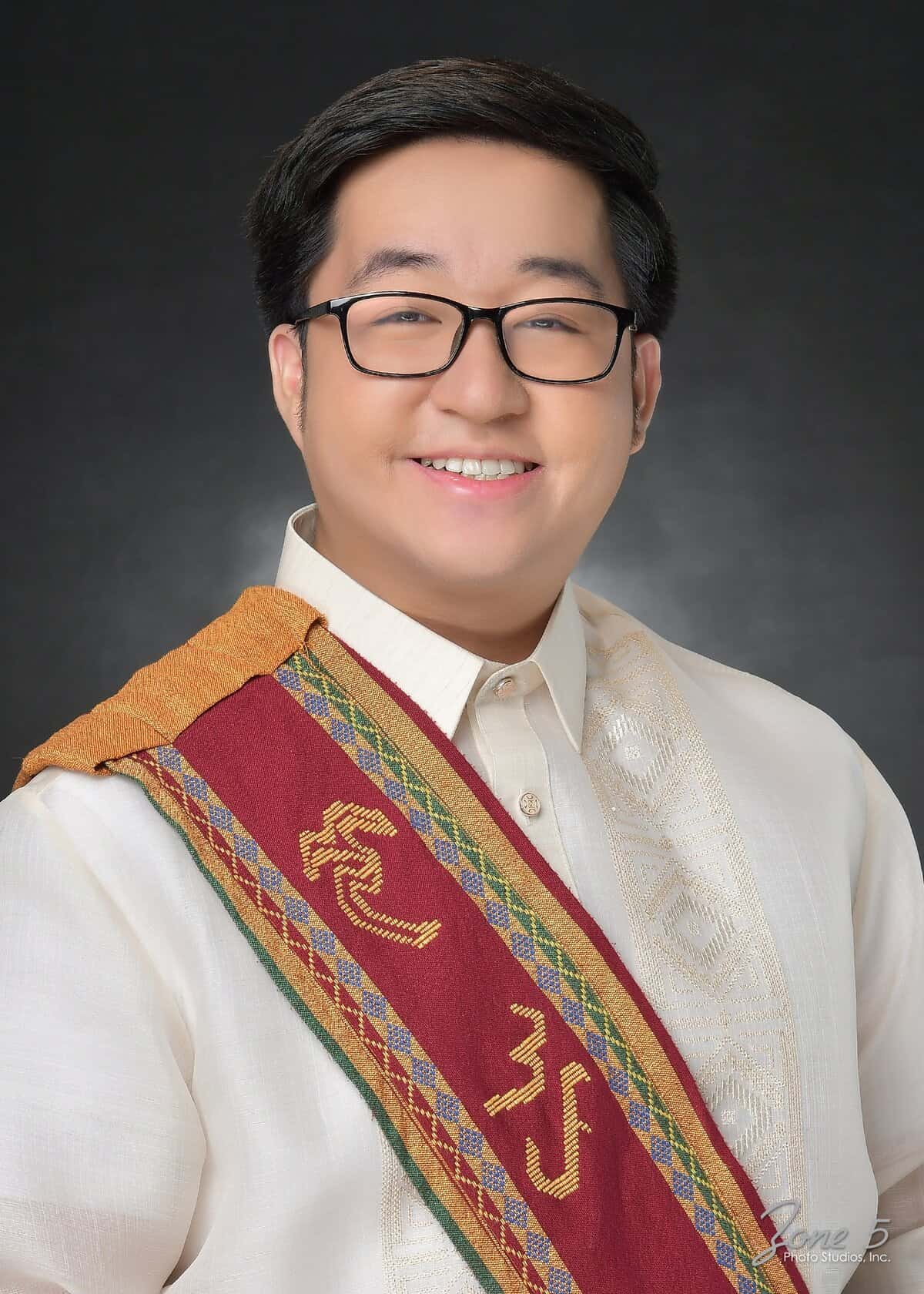Pinoy scientist Oey Mirabueno wearing eyeglasses and a traditional Filipino Barong Tagalog with sablay